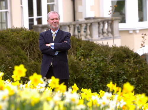 David Gold in the grounds of his home, 'The Chalet'.