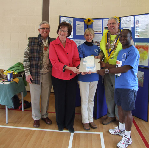 Vice-Chairman of Tandridge District Council, Alan Jones, Surrey County Councillor for Caterham Valley, Sally Marks, St. Catherine's Community Fundraiser, Rebecca Day, President of Caterham Round Table, Jim Burton and Conservative candidate for East Surrey, Sam Gyimah with the St. Catherine's Hospice first anniversary birthday cake. 