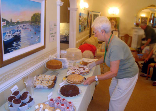 Vera Hadrill prepares the cake stall for the Big Coffee Morning at Asprey Court.