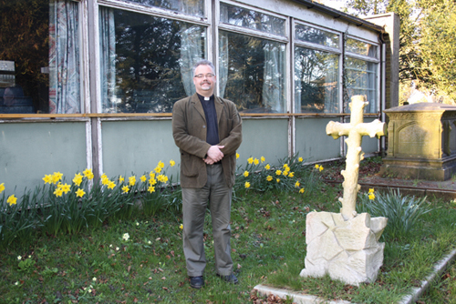 Reverend Duncan Swan outside the dilapidated church hall at St. Mary's in Caterham.