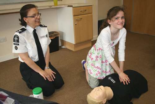 Anna Gardner (10) from Woldingham, learns how to do chest compressions.