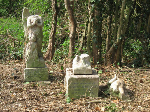 Two children's memorials at St. Lawrence's Hospital burial ground.  It was the practice to have angels as memorials for children's graves.