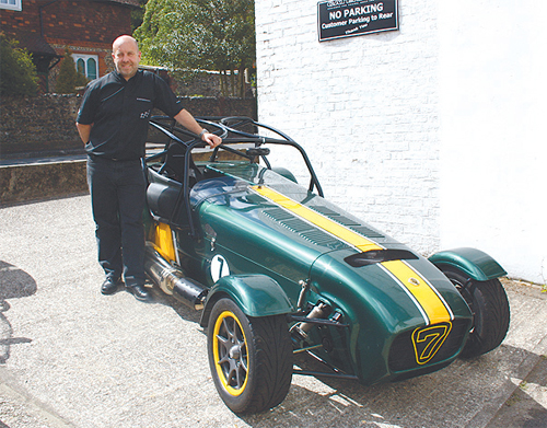 Sales and Marketing Director of Caterham Cars, Andy Noble,with the Caterham Seven in Team Lotus Enterprise colours.