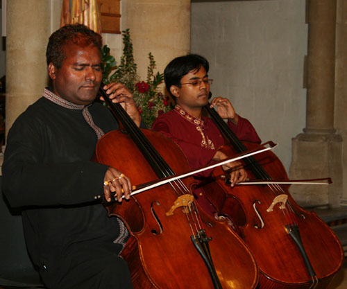 Anup Kumar (left) performing at the Sacred Heart Church last summer with a student from the Mathieson Music School.