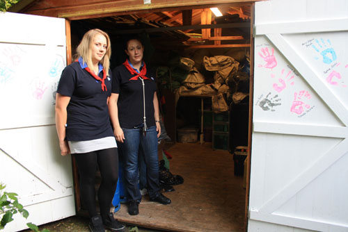 1st Chaldon Guide Leaders Michaela Pearce (left) and Claire Styles by the ransacked equipment shed.  