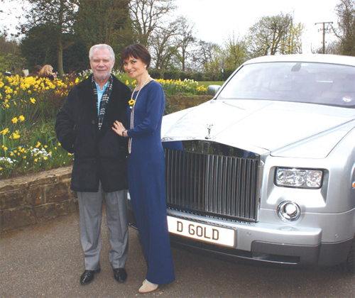 David Gold and his fiancée Lesley Manning in the grounds of 'The Chalet' in Tupwood Lane last spring. 