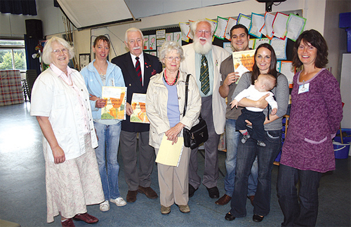 From left, Cllr. Hilary Turner, Sally Ward from the King & Queen, Peter McNeil from the Caterham Ex-Servicemens Club, Cllr. Mary Mountain, Mr Len Stebbings, Steve and Catherine Kirk from The Village Inn with baby Ethan and Cllr. Helen Broughton.