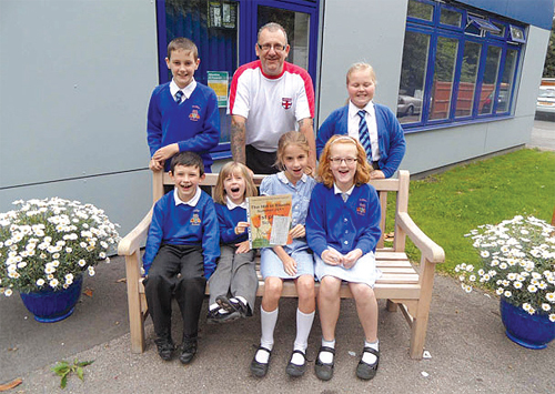 Children from Audley Primary School celebrate their award with Premises Manager, Steve Butler.