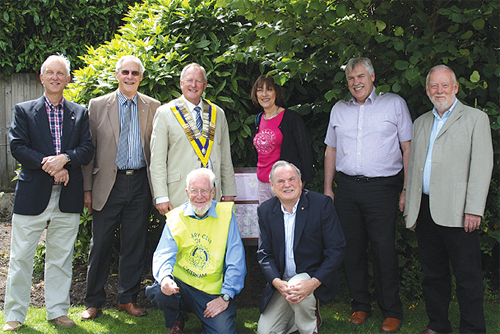 Members of Caterham and Caterham Harestone Rotary Clubs by the plaque in Queen's Park. Photograph by Felicity Lawrence