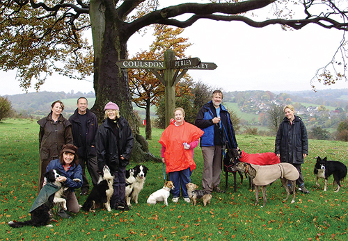 Club members and their dogs taking a rest during a sponsored walk.