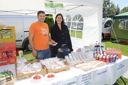 Ian Bristow from The Village Bakers at his refreshment stall with his assistant Poppy.