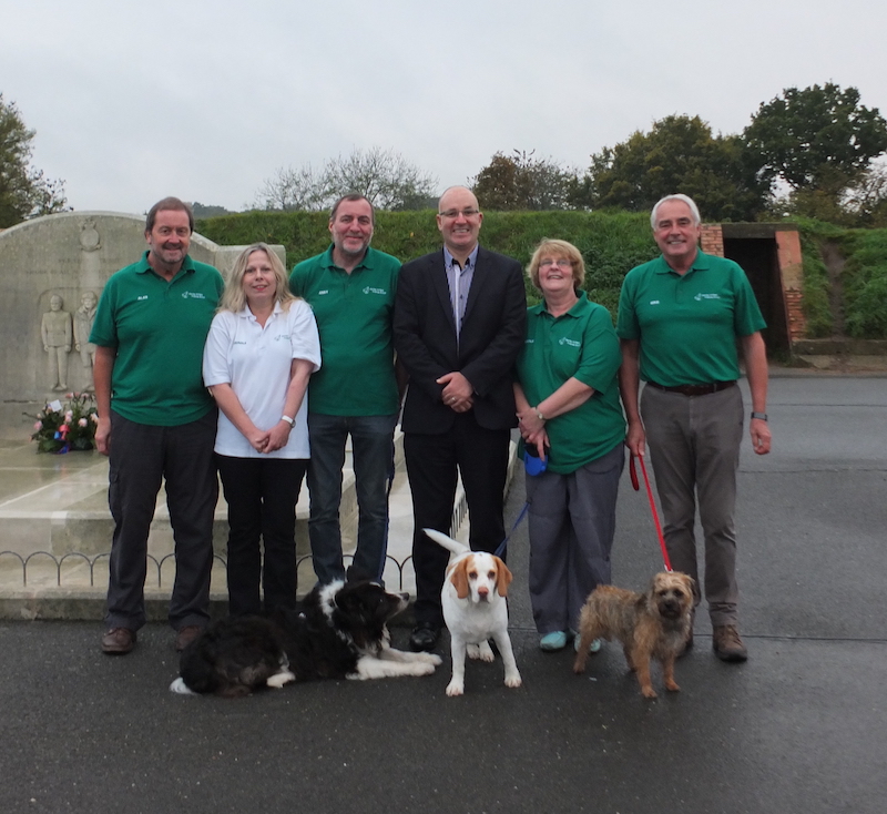 Delighted members of Kenley Airfield Friends Group by the Kenley Tribute, from left:  KAFG Chairman, Alan Morgan, Carole Streeter, Andy Spencer Jones, Scott Lester, Lesley West and Mike Rodwell.  Photo by James Highsted.