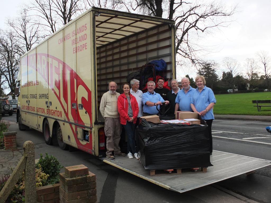 Geraint Jenkins MBE (centre, holding crate-loader handle) and Jo in the red jacket with C.H.E.C.K. supporters on the back of the Martell’s lorry in Banstead Road, Caterham-on-the-Hill.