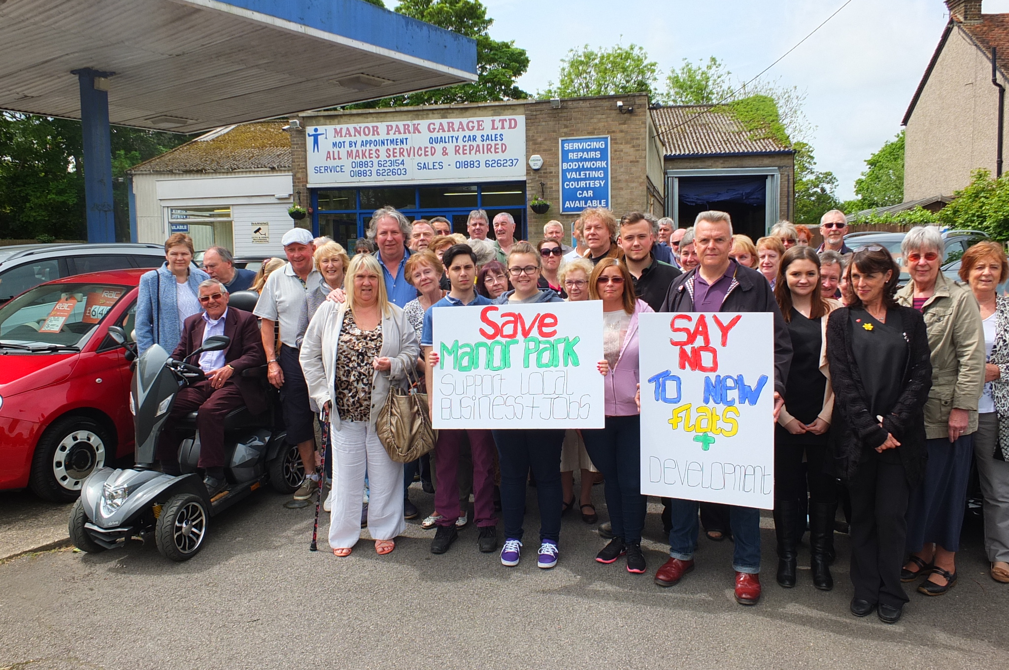 Warlingham residents showing their support for Manor Park Garage, which is threatened with closure if planning permission is granted for a block of flats to go on the site.